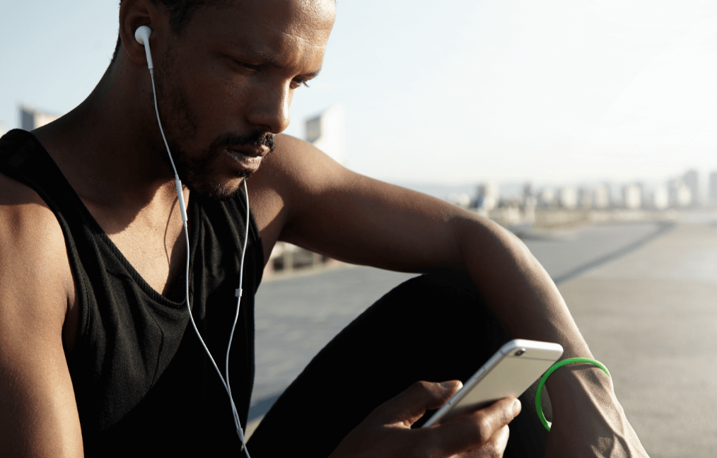 nice-photo-young-handsome-athlete-choosing-musical-track-running-digital-device-lonely-african-american-man-taking-break-from-his-workout-enjoying-beautiful-song-headphones