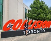 Some of the AdTonos team pose in front of a Collision Toronto sign